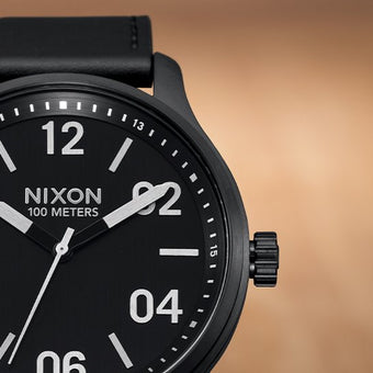 A closeup of a Nixon Analog watch.